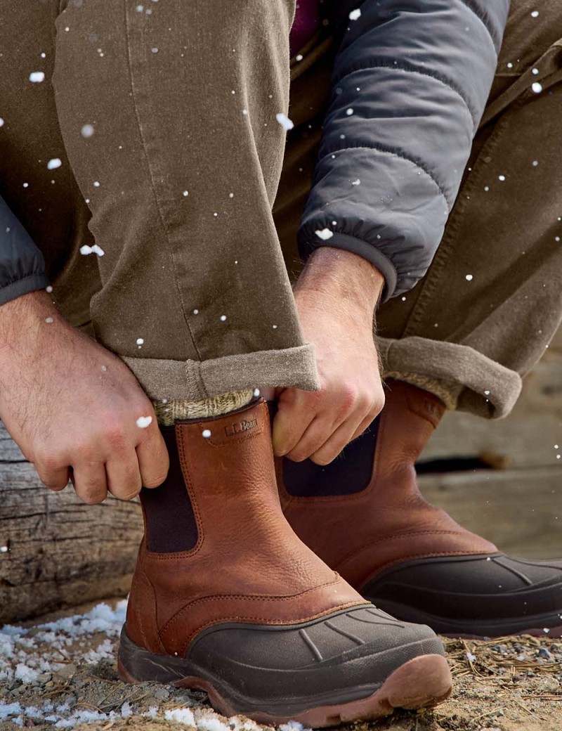 Close-up of boots in the snow